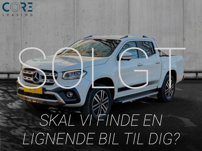 Hvidmetal Mercedes X250 d Power aut. 4Matic fra 2018 parkeret foran en betonmur. CORE Leasing A/S er eksperter i Mercedes leasing.