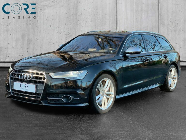 Sortmetal Audi S6 TFSi Avant quattro S-tr. fra 2015 parkeret foran en betonmur. CORE Leasing A/S er eksperter i Audi leasing.