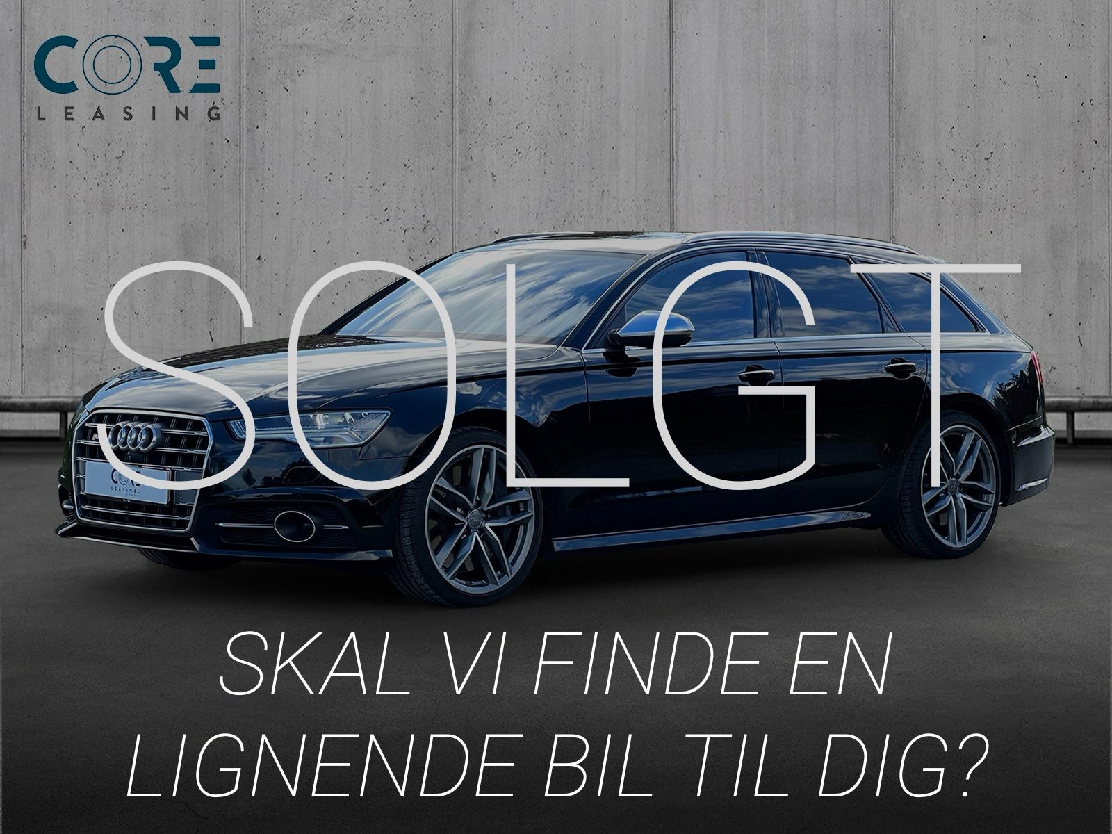 Sortmetal Audi S6 TFSi Avant quattro S-tr. fra 2015 parkeret foran en betonmur. CORE Leasing A/S er eksperter i Audi leasing.