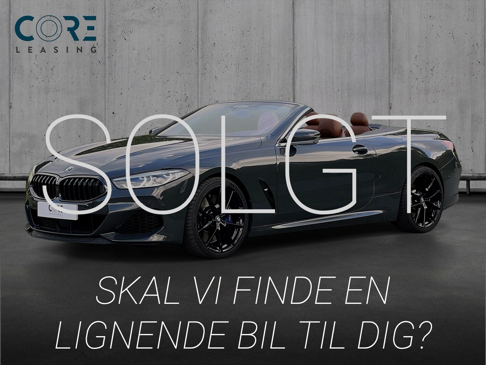 Gråmetal BMW M850i Cabriolet xDrive aut. fra 2019 parkeret foran en betonmur. CORE Leasing A/S er eksperter i BMW leasing.