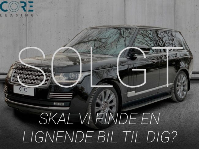 Sortmetal Land Rover Range Rover SDV8 Vogue aut. fra 2013 parkeret foran en betonmur. CORE Leasing A/S er eksperter i Land Rover leasing.