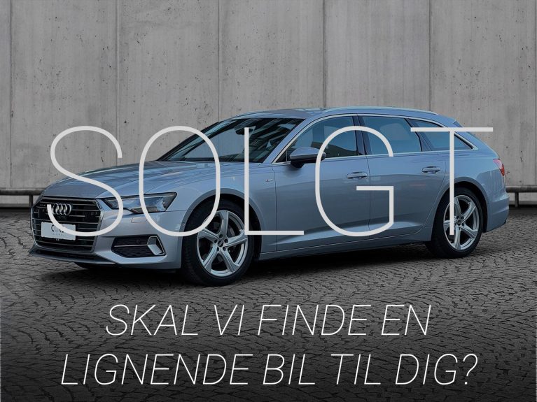 Sølvmetal Audi A6 TFSi Avant quattro S-tr. fra 2021 parkeret foran en betonmur. CORE Leasing A/S er eksperter i Audi leasing.
