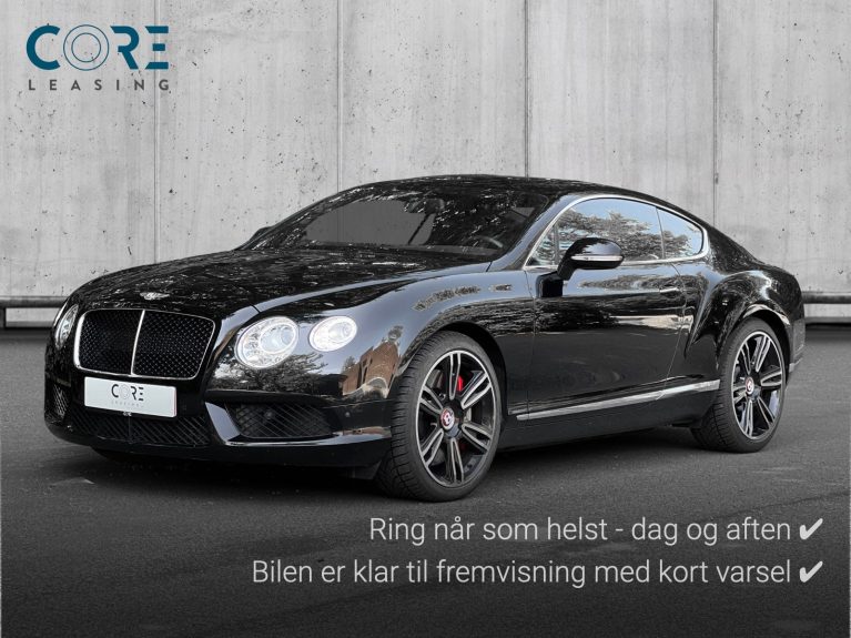 Sortmetal Bentley Continental GT V8 aut. fra 2012 parkeret foran en betonmur. CORE Leasing A/S er eksperter i Bentley leasing.