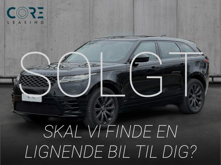 Sortmetal Land Rover Range Rover Velar P380 R-Dynamic HSE aut. fra 2017 parkeret foran en betonmur. CORE Leasing A/S er eksperter i Land Rover leasing.