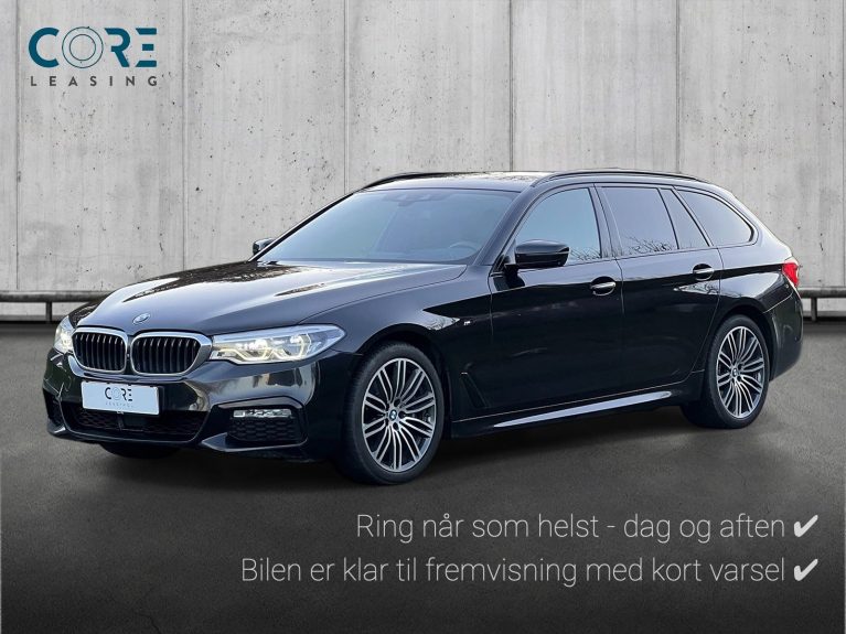 Sortmetal BMW 540d Touring M-Sport xDrive aut. fra 2018 parkeret foran en betonmur. CORE Leasing A/S er eksperter i BMW leasing.