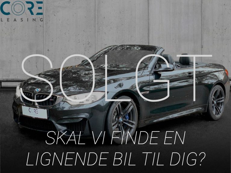 Sortmetal BMW M4 Cabriolet aut. fra 2016 parkeret foran en betonmur. CORE Leasing A/S er eksperter i BMW leasing.