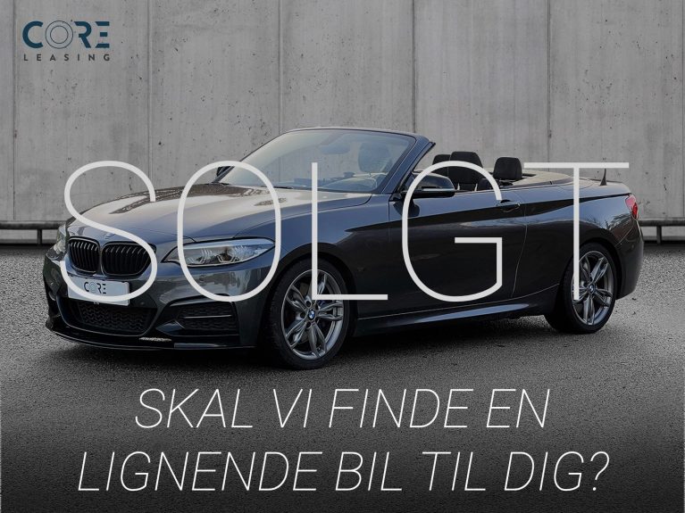 Gråmetal BMW M240i Cabriolet aut. fra 2018 parkeret foran en betonmur. CORE Leasing A/S er eksperter i BMW leasing.