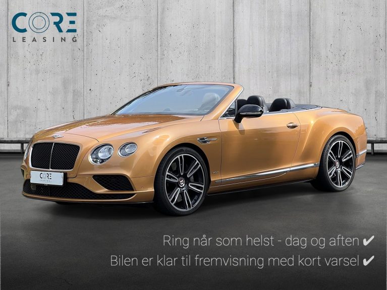 Guldmetal Bentley Continental GTC V8 S aut. fra 2016 parkeret foran en betonmur. CORE Leasing A/S er eksperter i Bentley leasing.