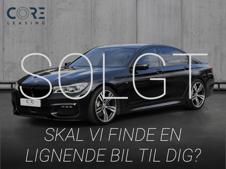 Sortmetal BMW 740i M-Sport aut. fra 2018 parkeret foran en betonmur. CORE Leasing A/S er eksperter i BMW leasing.
