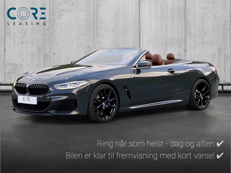 Gråmetal BMW M850i Cabriolet xDrive aut. fra 2019 parkeret foran en betonmur. CORE Leasing A/S er eksperter i BMW leasing.