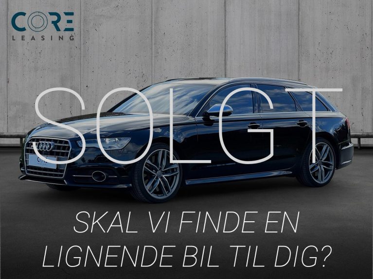 Sortmetal Audi S6 TFSi Avant quattro S-tr. fra 2015 parkeret foran en betonmur. CORE Leasing A/S er eksperter i Audi leasing.