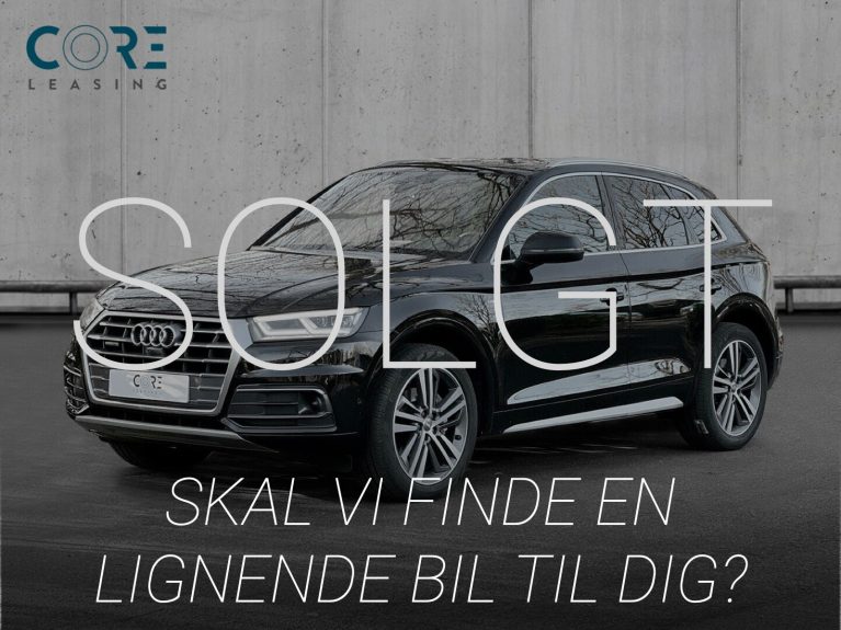Sortmetal Audi Q5 TDi 190 S-line quattro S-tr. fra 2017 parkeret foran en betonmur. CORE Leasing A/S er eksperter i Audi leasing.